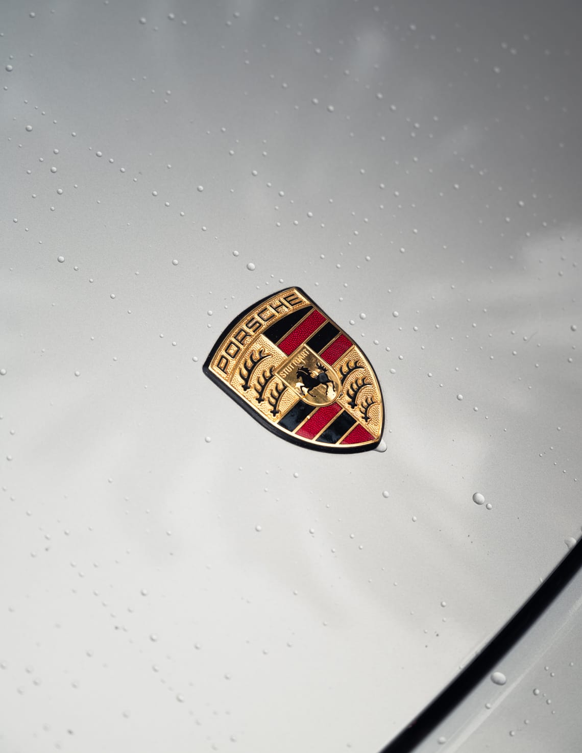 Close-up view of the Porsche emblem of a 996 Porsche 911