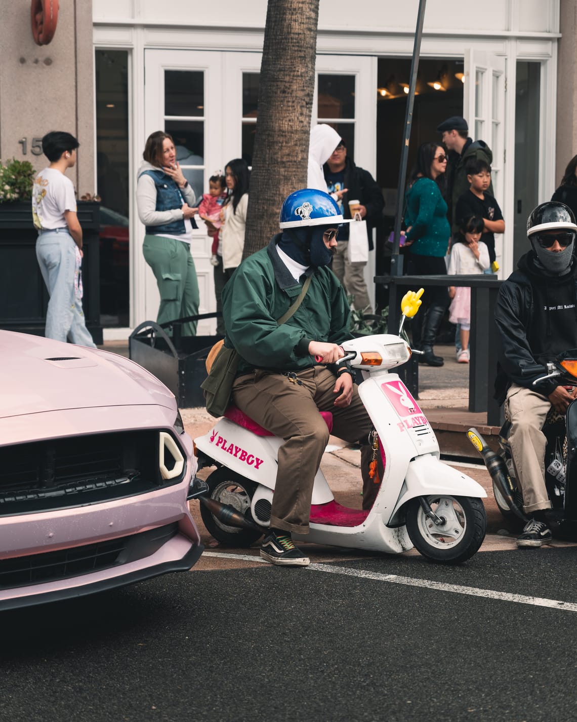 Person sitting on motorized scooter